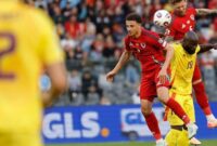 Ethan Ampadu dan Joe Rodon (Wales) berduel dengan Romelu Lukaku (Belgia) dalam laga kualifikasi Piala Dunia 2026 Grup J di Stadion King Baudouin, Brussels, Senin (9/6/2025). (AP Photo/Geert Vanden Wijngaer)